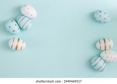 Easter eggs on blue background. Happy easter poster and banner for greeting text. Top view - Powered by Shutterstock