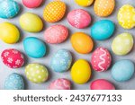 Easter eggs on a bright blue background. Easter celebration concept. Colorful easter handmade decorated Easter eggs. Place for text. Copy space.