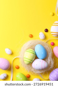Easter eggs on a colored background, festive background . Vertical photo format	