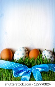 Easter Eggs On The Grass/Background  With Easter Eggs And  Green Grass