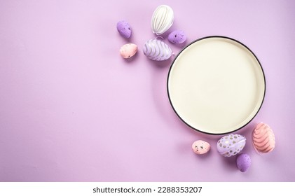 Easter eggs on plate purple background. Happy Easter holiday concept. - Powered by Shutterstock