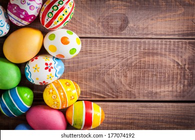 Easter eggs on wooden background  - Shutterstock ID 177074192