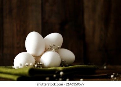 Easter Eggs On A Wooden Background. White Eggs. White Eggs On A Green Cloth Napkin.