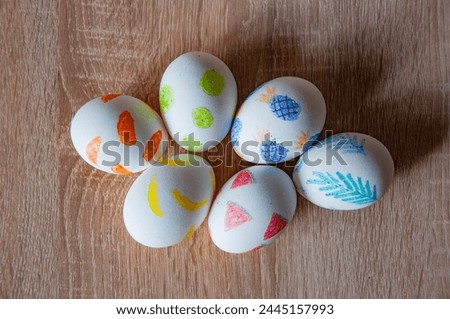 Easter eggs on wooden table. Happy Easter holiday celebration. Easter bunny hunt. Spring holiday at Sunday. Eastertide and Eastertime. Good Friday. Hunting eggs. Painted eggs.