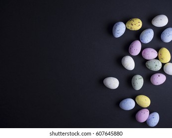 Easter eggs in pastel colors isolated on black background