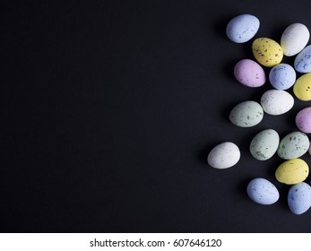 Easter eggs in pastel colors isolated on black background