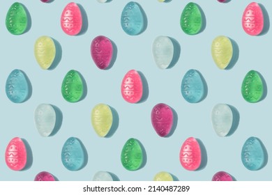 Easter Eggs Pattern Made Of Colorful Soft Candy On A Pastel Blue Background. Happy Easter Minimal Backdrop.