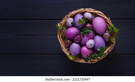 Easter eggs  purple   lilac   gray wooden table  Easter card  banner  selective focus  horizontal