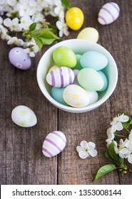 Easter eggs and spring cherry  blossom on a old wooden background