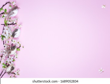 Easter eggs and spring flowers on a pink background with copy space. - Shutterstock ID 1689052834