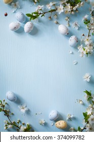 Easter Eggs And Spring Flowers On Wooden Background 