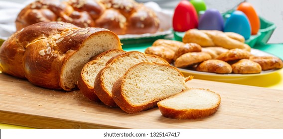 Easter Eggs And Tsoureki Braid, Greek Easter Sweet Bread Sliced On Wood, Banner, Closeup View