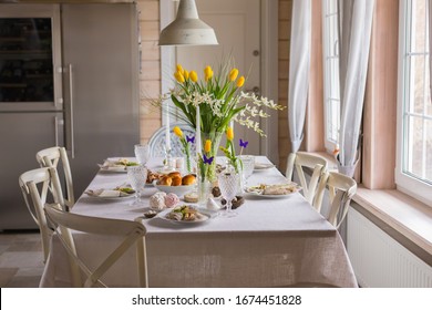 Easter Festive Spring Table Setting Decoration, Eggs In Nest, Fresh Yellow Tulips In Vase, Marshmallows, Feathers, Family Dinner Or Breakfast Concept, Toned