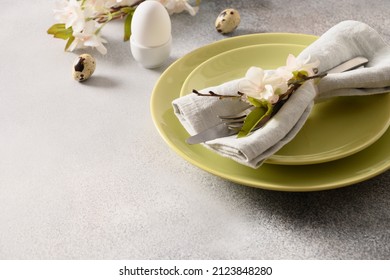 Easter Festive Table Setting And Spring Decorations On Gray Background. Close Up. Template Easter Buffet Menu.