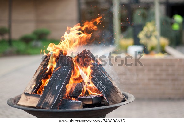 Easter\
fire for the Easter vigil in front of a\
church