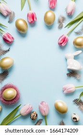 Easter Frame Of Bunny, Golden Eggs, Pink Tulips On Pastel Blue Background. Top View. Happy Easter Holiday. Greeting Card. Vertical Composition. Easter Buffet Menu.