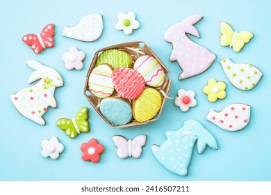 Easter gingerbread cookies top view on blue, - Powered by Shutterstock