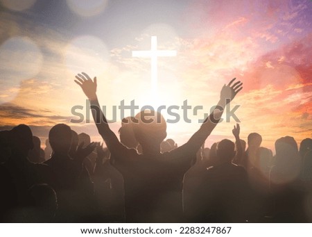 Easter and Good Friday concept,  soft focus of Christian worship with raised hand on white cross background