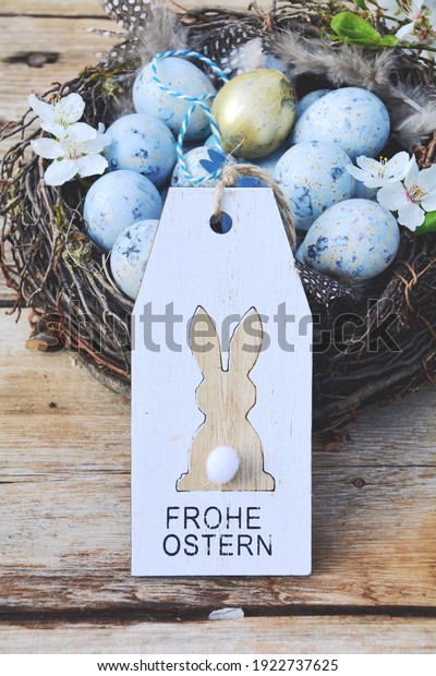 Easter greeting card with text in German - Frohe\
Ostern - Easter nest with\
eggs	