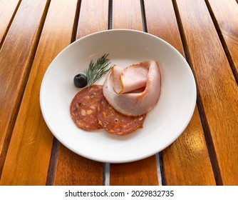 Easter Ham And Pepperoni In White Ceramic Dish On Wooden Table, Selective Focus. Pepperoni Is An American Variety Of Salami, Made From Cured Pork And Beef Seasoned With Paprika Or Other Chili Pepper