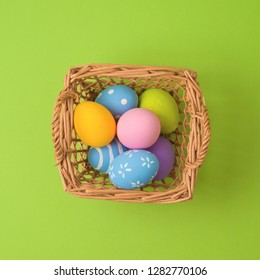 Easter Holiday Concept With Easter Eggs In Basket Decorations. Minimal Concept. Top View From Above. Flat Lay