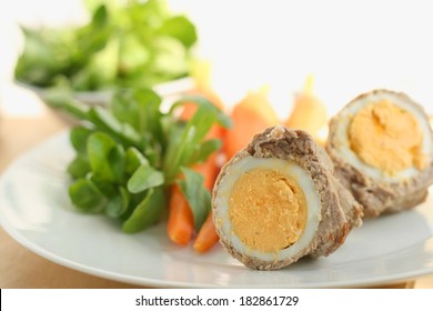 Easter Lunch Or Dinner Recipe Idea, Cooked Egg In A Roll Of Veal Meat, Served With Cooked Carrots, Potato And Fresh Corn Salad