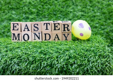 Easter Monday Wooden Block On Green Grass