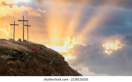 Easter morning, Golgotha hill with silhouettes of the cross, Resurrection background with sunlight, abstract background with copy space for text - Shutterstock ID 2138116101