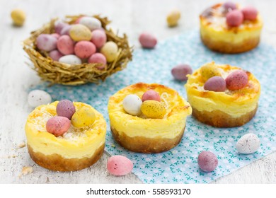 Easter Nest Cakes With Colorful Chocolate Candy Eggs On Festive Easter Table , Easter Holiday Recipe