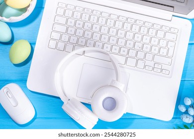 Easter office workplace, preparation for holiday, spring Easter sale, blogging. White laptop keyboard with easter eggs basket and flower branch decorations, on light blue wooden table top view  - Powered by Shutterstock