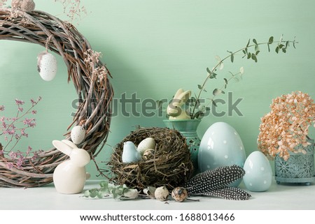 Easter ornaments in light and pastel colors with clear light, with eggs and rabbits, ornaments for the home, interior, bird nest with eggs inside