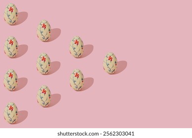 Easter pattern composition made with floral vintage Easter eggs on light pink background. Minimal Easter concept. Creative festive holiday layout. Spring pattern backdrop.