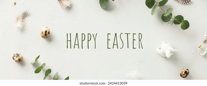 Easter poster and banner template with eucalyptus branches, eggs, feathers, ceramic bunny on light grey background top view flat lay banner. Greetings and presents for Easter Day in flat lay styling. - Powered by Shutterstock