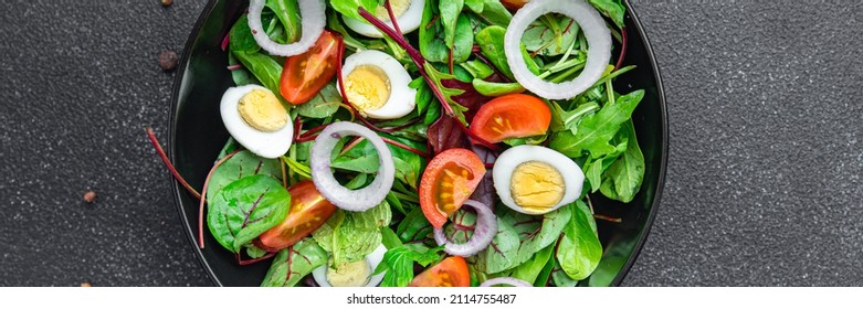 Easter salad vegetable quail egg tomato mix leaves healthy meal food snack on the table copy space food background 