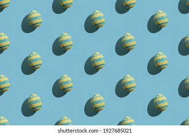 Easter seamless pattern. Festive background. Holiday art. Abstract banner. Yellow eggs with blue paschal ornament isolated on pastel textured.