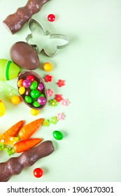 Easter Set With Eggs, Carrots, Chocolate Bunny, Cookie Cutter. Top View. Copy Space.