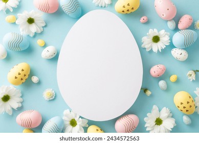 Easter setting idea: Overhead view of various eggs, and chamomile shoots on a tranquil blue surface, with an open egg-shaped outline for messages or advertising - Powered by Shutterstock - Get 15% off with code: PIKWIZARD15