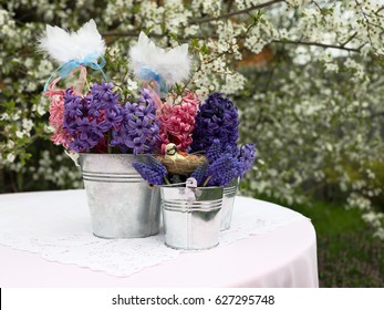 Easter spring composition of hyacinths and muscari in a flowering garden. - Shutterstock ID 627295748