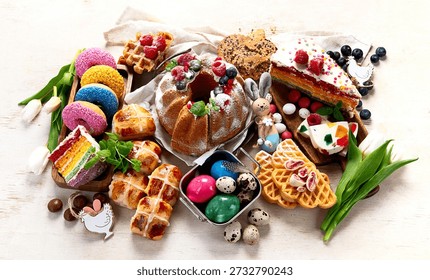 Easter or spring dessert  assortment of breads, desserts and treats on a light background. Top view.