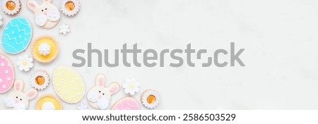 Similar – Image, Stock Photo From above of Easter-themed flatlay featuring a nest with speckled eggs, surrounded by soft feathers and pussy willow branches on a textured background