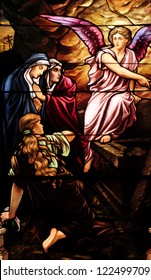 Easter Stained Glass Window Depicting Mary Magdalen And Women At The Empty Tomb Of Jesus On Day Of Resurrection