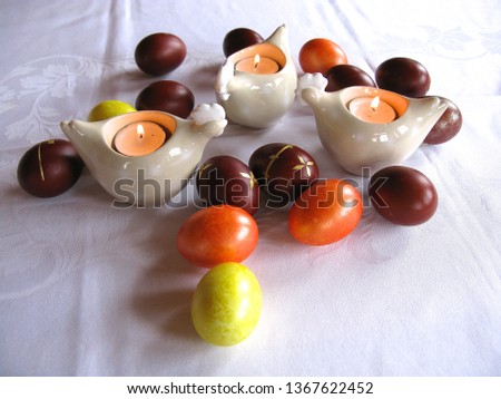 Easter symbols - Ester cake and eggs with oak grass and porcelain  figures of chicken.