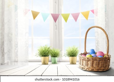 Easter Table Background Of Free Space For Your Product. Blurred Window Background. Eggs And Flowers Decoration. 