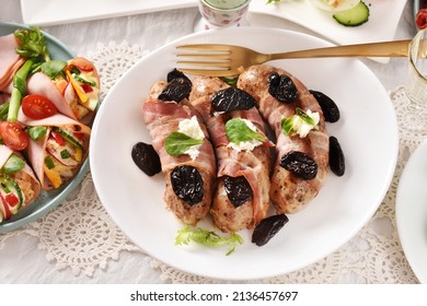 Easter Table With Grilled White Sausage Wrapped In Bacon With Prune And Horseradish