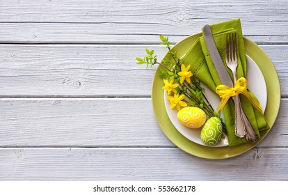 Easter Table Setting With Daffodil And Cutlery. Holidays Background