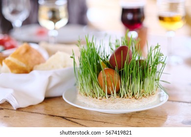 Easter Table Setting With Eggs, Wine And Decoration