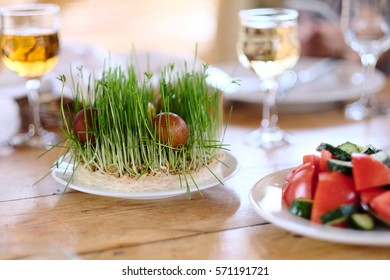 Easter Table Setting With Eggs, Wine And Decoration