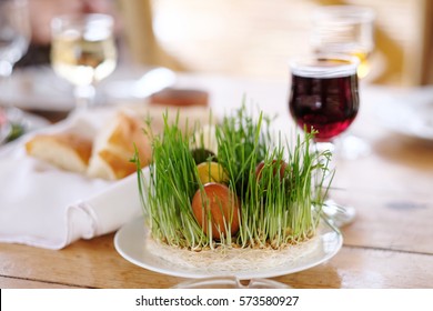 Easter Table Setting With Eggs, Wine And Decoration