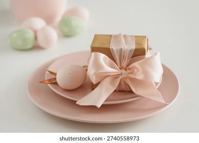 Easter Table Setting with Gift Box, Decorated Eggs and Tulips. Festive Spring Lifestyle