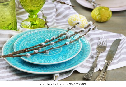 Easter table setting on color wooden background - Powered by Shutterstock